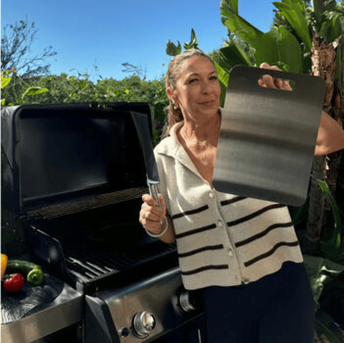 Customer using a titanium cutting board outdoors